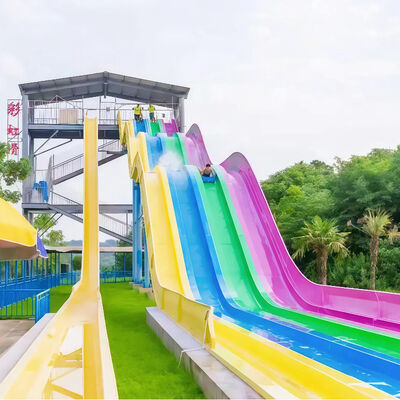 kualitas 4 Lane Racing Rainbow Slide Fiberglass Dewasa Perlengkapan Taman Air Disesuaikan untuk Taman Hiburan Komersial Penjualan pabrik